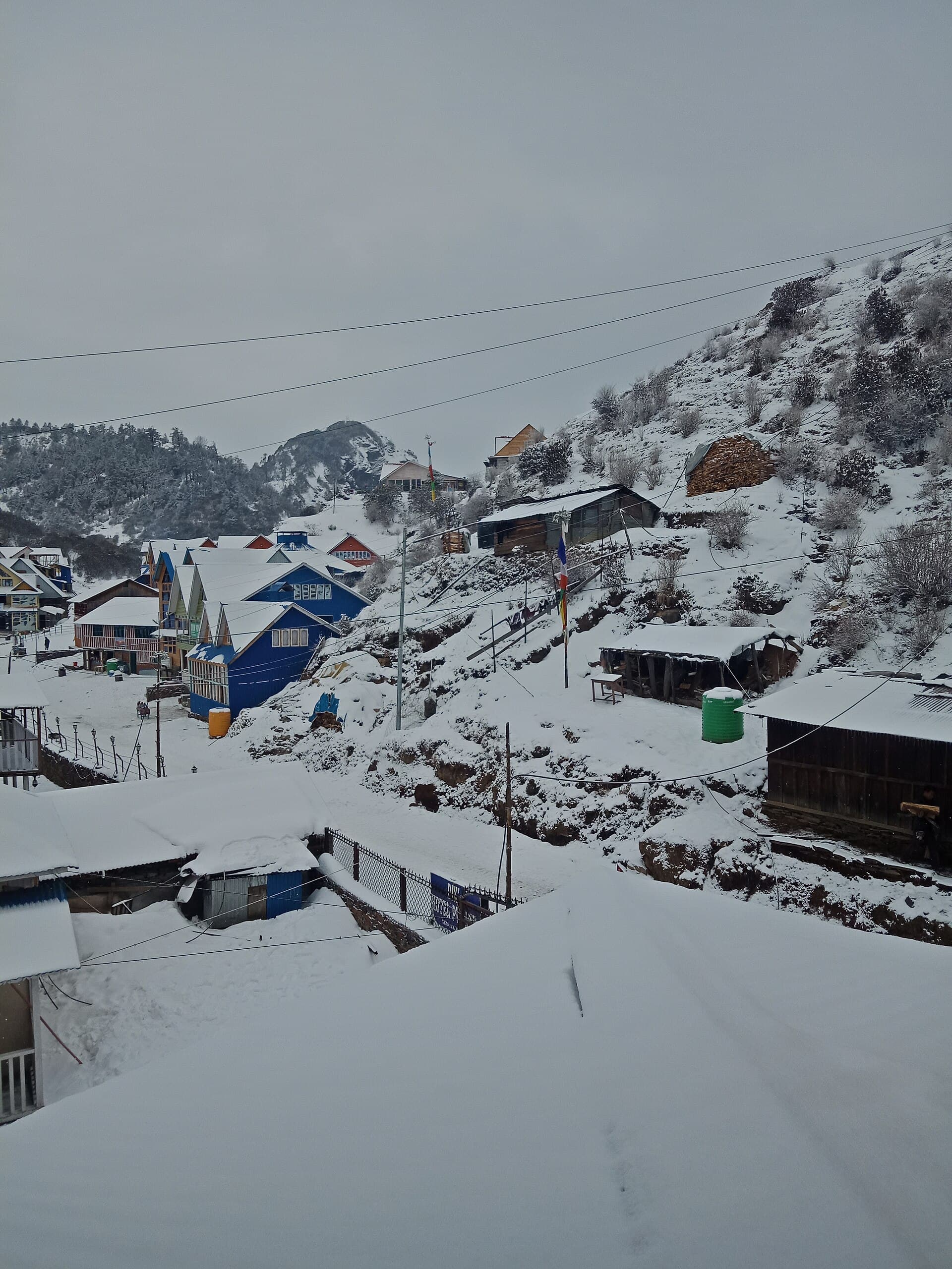 Snow covered colorful village of Kuri beneath Kalinchowk in Nepal